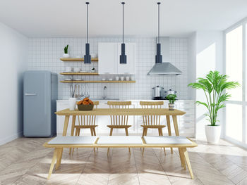 Modern scandinavian kitchen and dinning room interior,wood table and wood chair 