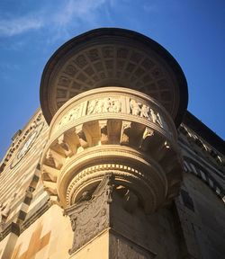 Low angle view of historical building against blue sky