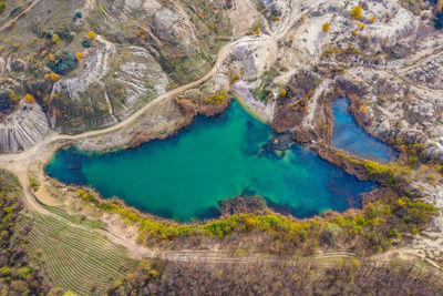 Drone view of industrial opencast mine filled with water. aerial shot of artificial lake