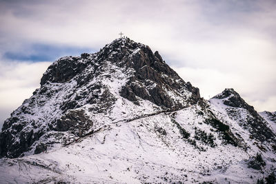 Scenic view of snow covered mountain against sky