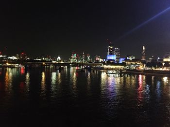 Illuminated city at waterfront