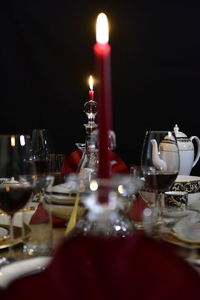 Close-up of wine glasses on table