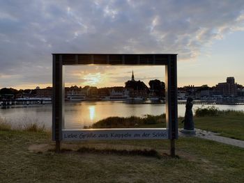 Scenic view of river against sky during sunset