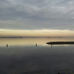 Scenic view of sea against cloudy sky