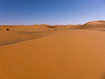 Scenic view of desert against clear sky