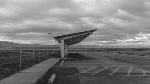 Airplane on road against sky