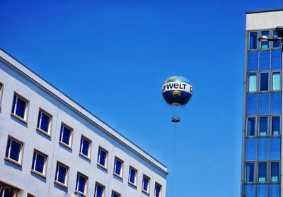 Low angle view of building against blue sky