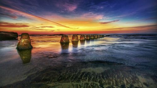 Scenic view of sea at sunset