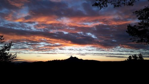 Low angle view of dramatic sky during sunset