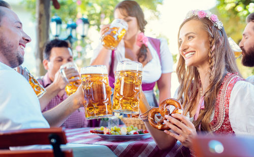 People holding drink in glasses