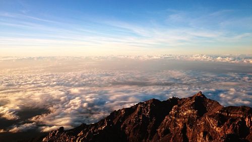 Scenic view of mountains against sky at sunset