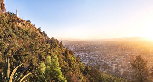 Scenic view of mountains against clear sky during sunset