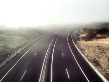 Road on landscape against sky