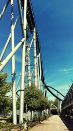 Low angle view of bridge against blue sky