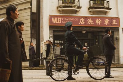 People walking on street in city