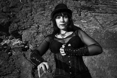 Portrait of young woman standing outdoors