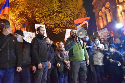 Group of people standing outdoors at night