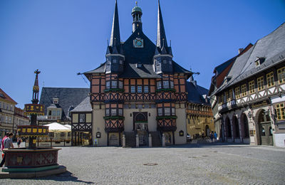 View of buildings in town against sky