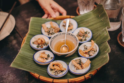 High angle view of person preparing food on table