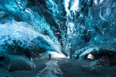 Person walking in cave