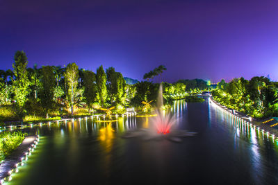 Scenic view of river against sky at night