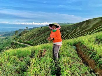 Scenic view of farm against sky