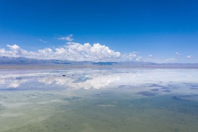 Scenic view of sea against blue sky