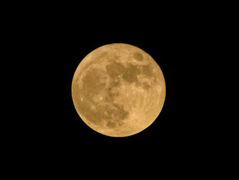 Scenic view of full moon against sky at night