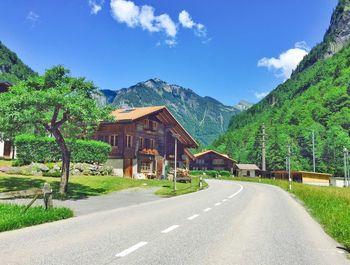 Empty road leading towards mountains