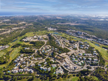 High angle view of buildings in city against sky