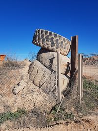 Built structure on land against clear blue sky