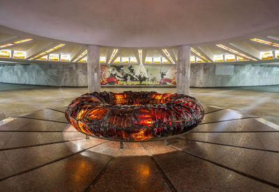 Illuminated lighting equipment on tiled floor