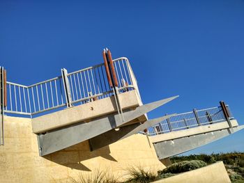 Low angle view of built structure against blue sky