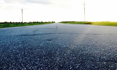 Empty road along landscape