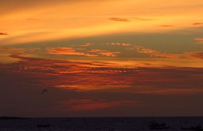 Scenic view of sea against orange sky