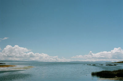 Scenic view of sea against blue sky
