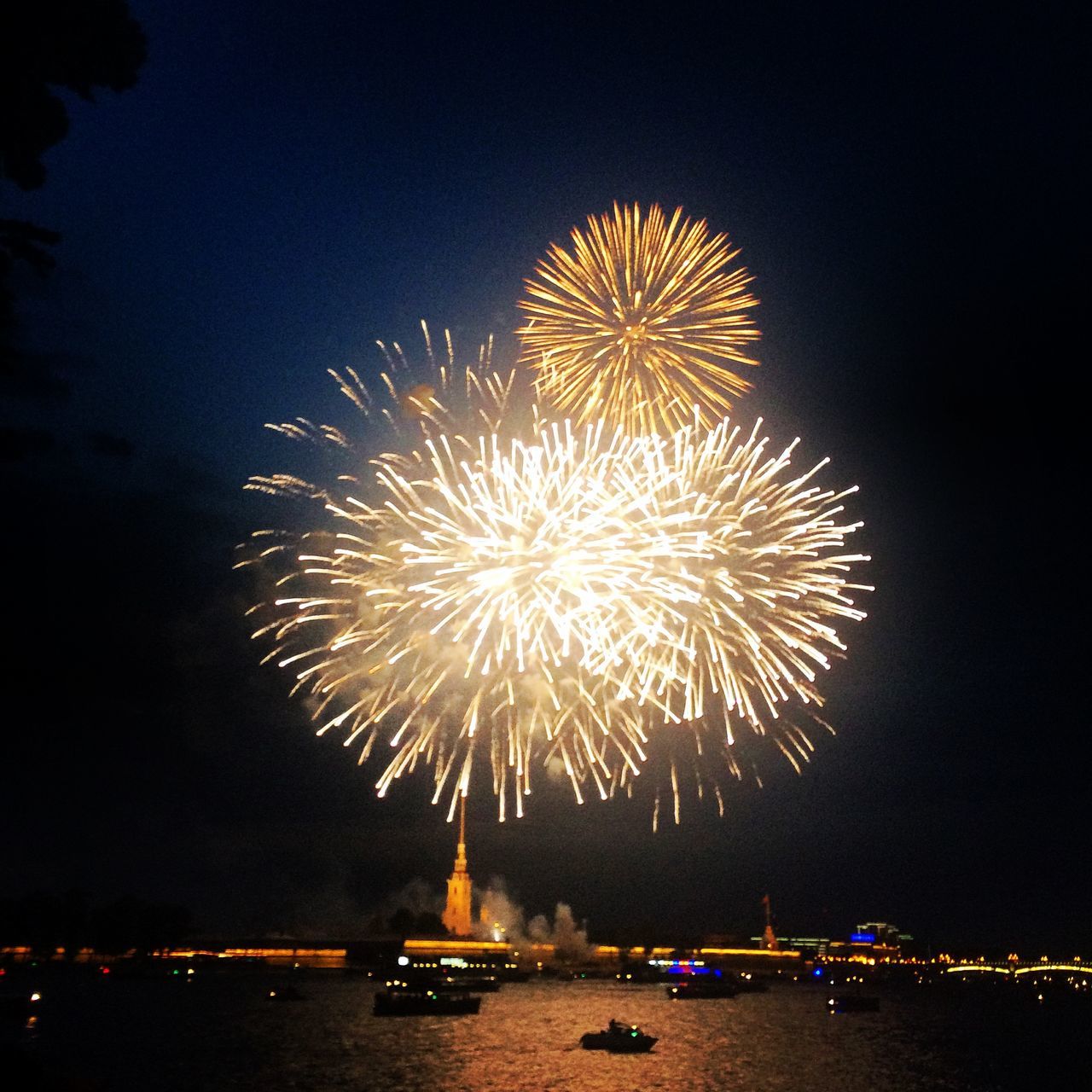 illuminated, night, firework display, exploding, long exposure, celebration, firework - man made object, arts culture and entertainment, glowing, motion, sparks, event, firework, entertainment, blurred motion, sky, fire - natural phenomenon, water, multi colored, celebration event