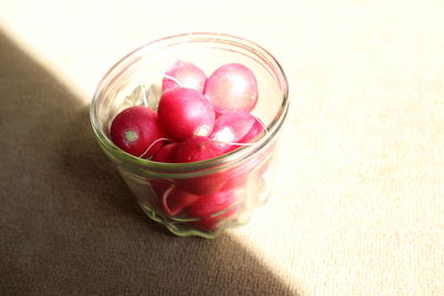 High angle view of strawberries in glass on table