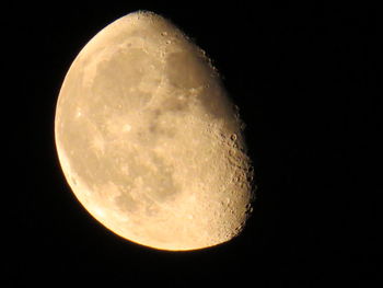 Low angle view of moon against clear sky at night