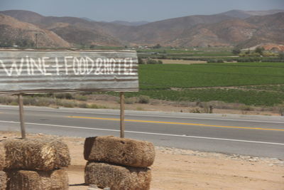 View of landscape with mountain range in background