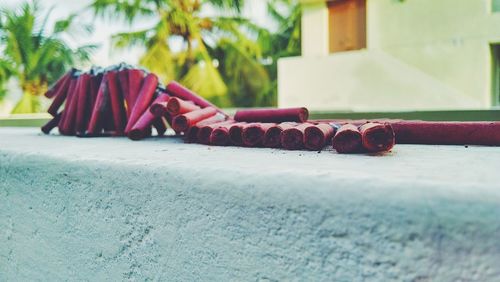 String of firecrackers on retaining wall