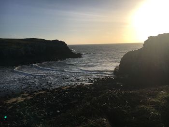 Scenic view of sea against sky at sunset