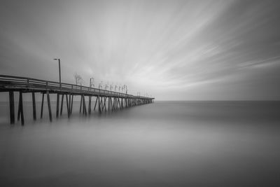 Pier over sea against sky