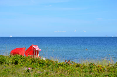 Scenic view of sea against clear blue sky