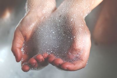 Close-up of wet woman in bathtub