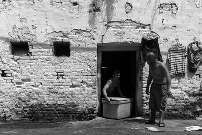 Woman standing in front of building