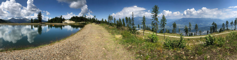 Panoramic view of trees on landscape against sky