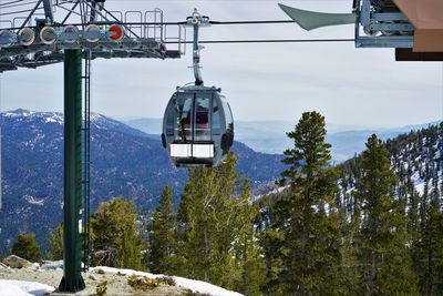 Overhead cable car against sky during winter