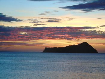 Scenic view of sea against dramatic sky