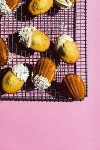 High angle view of madeleines against pink background